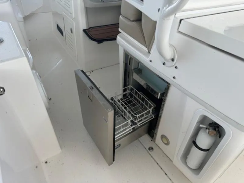 Slide: The Image of 2016 Everglades 360LXC boat interior with open stainless steel drawer. - 3