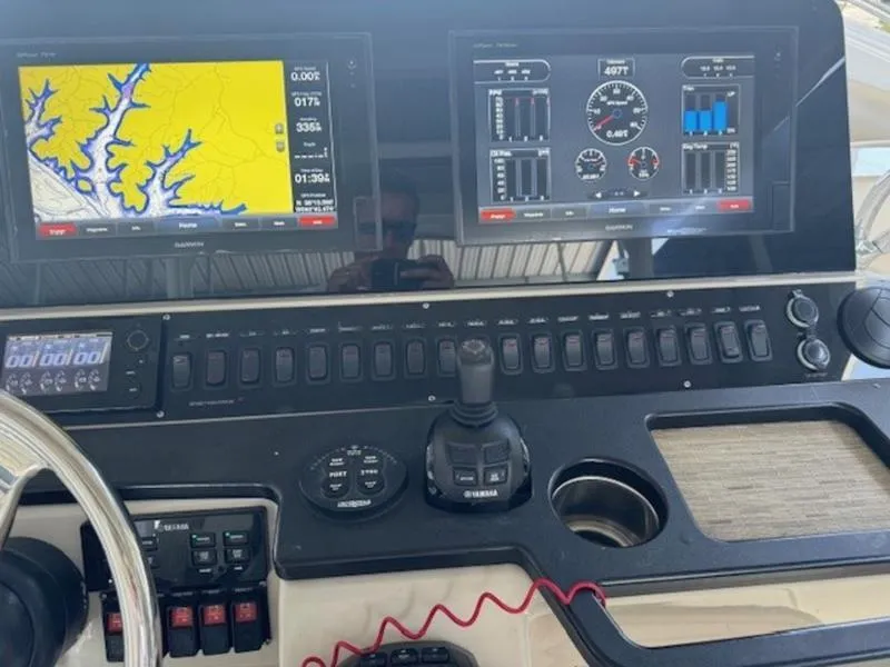 Slide: The Image of Control panel of 2016 Everglades 360LXC boat with navigation and engine displays. - 39