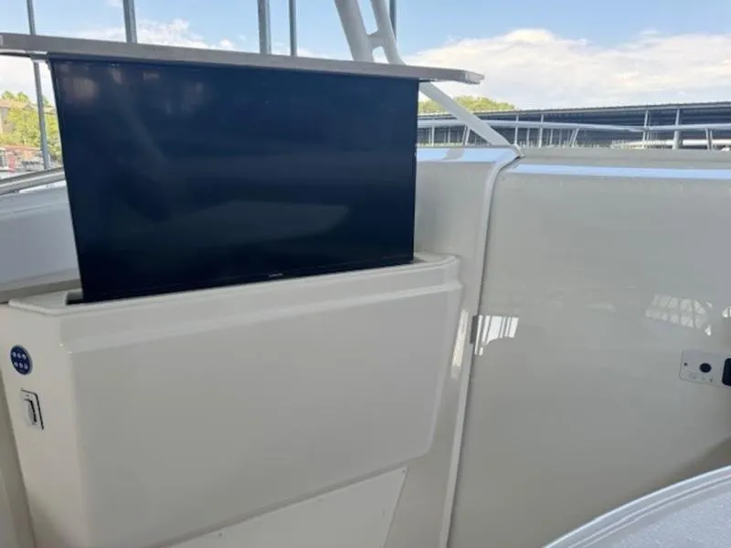 Slide: The Image of Everglades 360LXC 2016 boat with retractable TV on deck. - 47