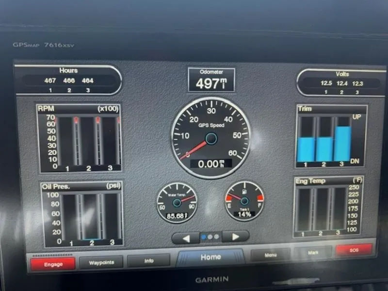 Slide: The Image of Garmin display showing Everglades 360LXC 2016 boat metrics: RPM, GPS speed, trim, and engine temperature. - 7