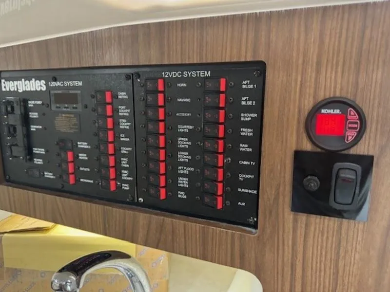 Slide: The Image of Control panel of 2016 Everglades 360LXC boat with 12VDC and 120VAC systems. - 8