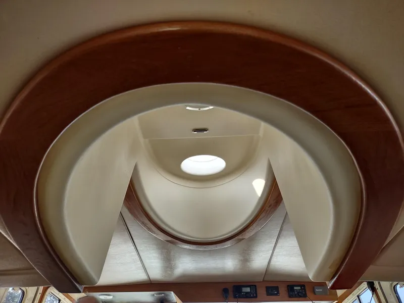 Slide: The Image of Interior ceiling of a 2003 American Tug 34 boat with circular skylight. - 22