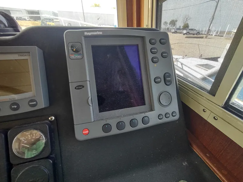 Slide: The Image of Control panel of a 2003 American Tug 34 with Raymarine display. - 29