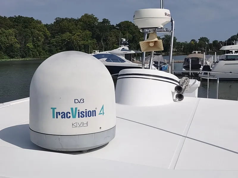 Slide: The Image of American Tug 34 (2003) with TracVision 4 satellite system, docked near other boats. - 3