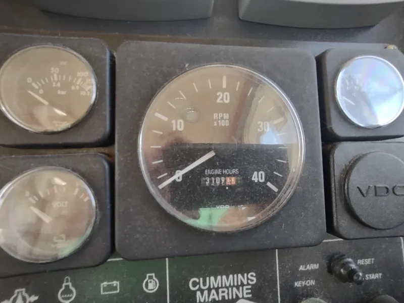 Slide: The Image of Instrument panel of a 2003 American Tug 34, featuring RPM and engine hours gauges. - 30