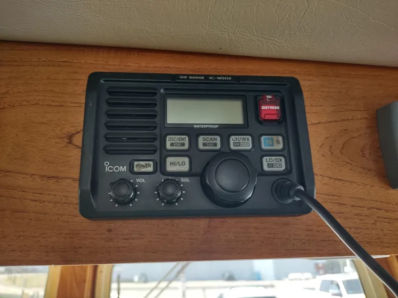 Slide: The Image of ICOM VHF marine radio installed on a 2003 American Tug 34 boat. - 35