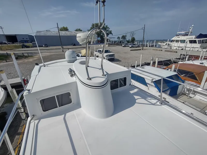 Slide: The Image of 2003 American Tug 34 boat deck with marina background. - 6