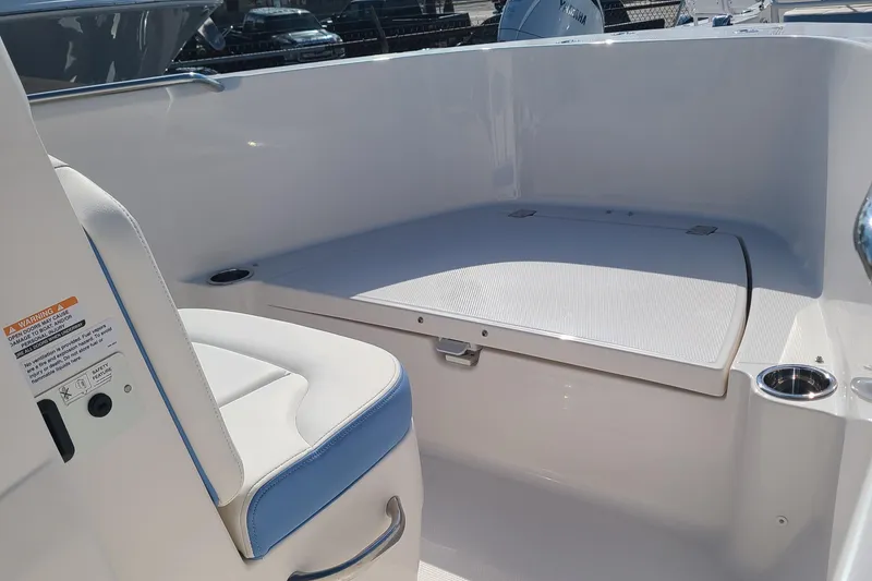 Slide: The Image of 2024 Robalo R180 Center Console boat interior with seating and storage. - 6