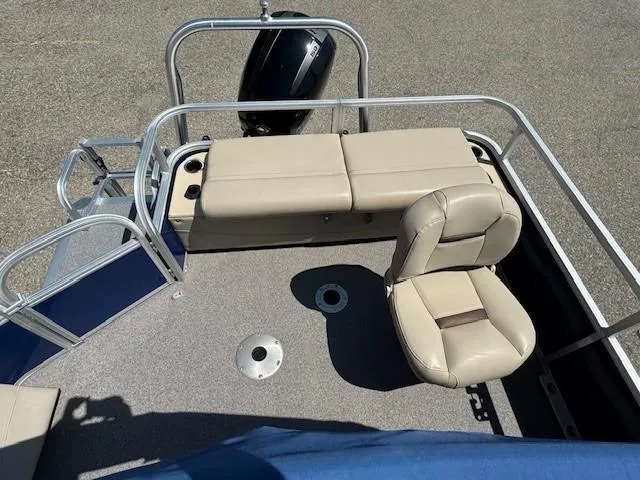 Slide: The Image of 2017 Sun Tracker Fishin' Barge 22 DLX with beige seating and motor. - 12