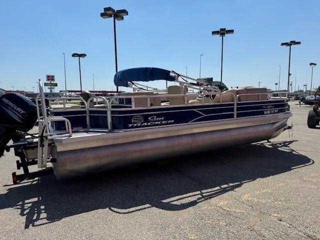 Slide: The Image of 2017 Sun Tracker Fishin' Barge 22 DLX pontoon boat in parking lot. - 4