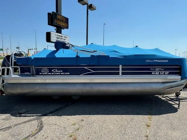 Slide: The Image of 2017 Sun Tracker Fishin' Barge 22 DLX pontoon boat with blue cover. - 6
