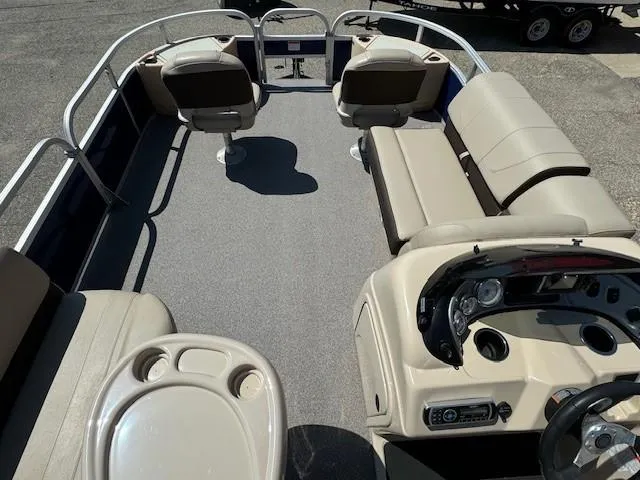 Slide: The Image of 2017 Sun Tracker Fishin' Barge 22 DLX interior with seating and control panel. - 9
