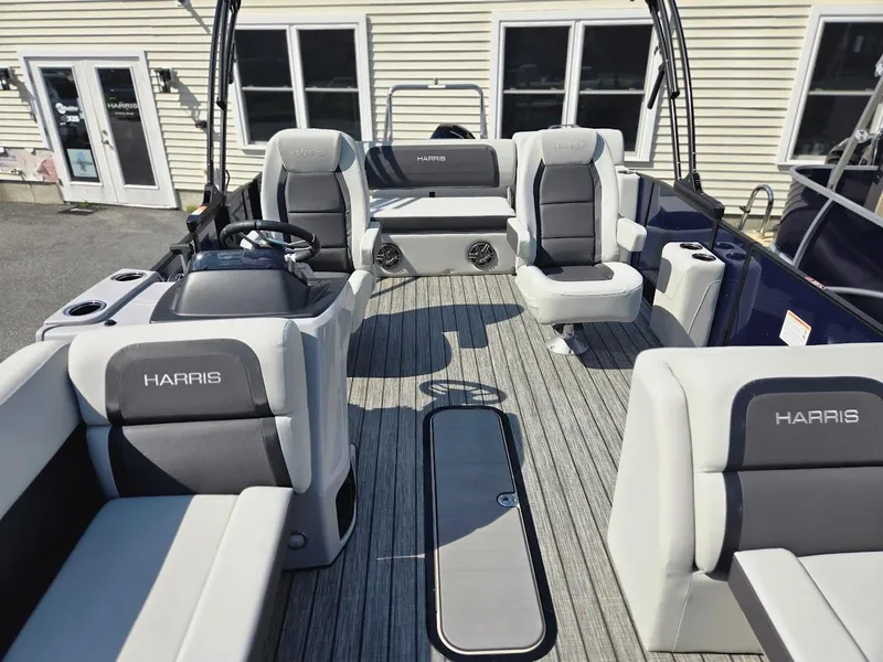 Slide: The Image of 2025 Harris Cruiser 230 boat interior with gray seating and modern design. - 3