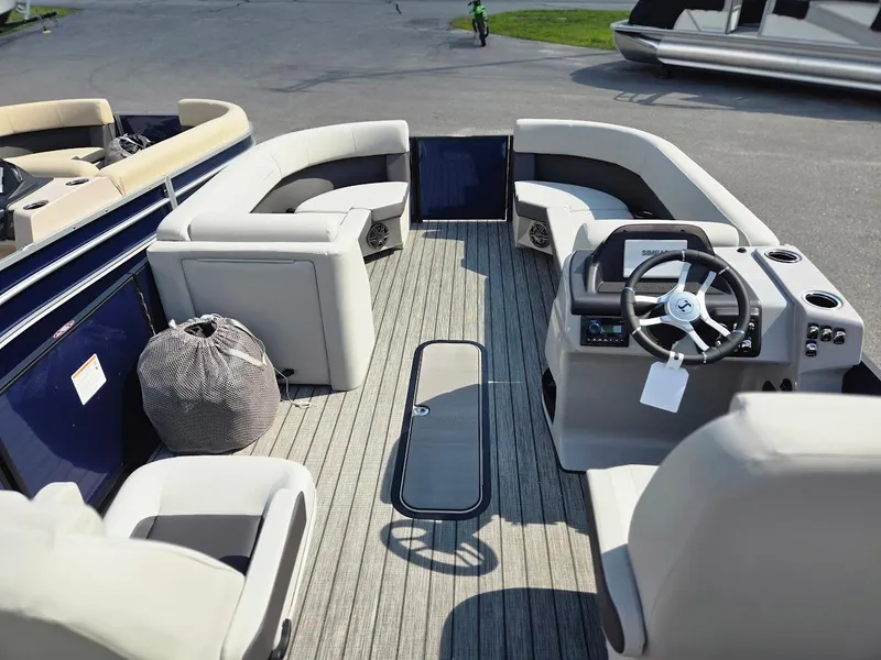 Slide: The Image of 2025 Harris Cruiser 230 boat interior with plush seating and modern steering console. - 4