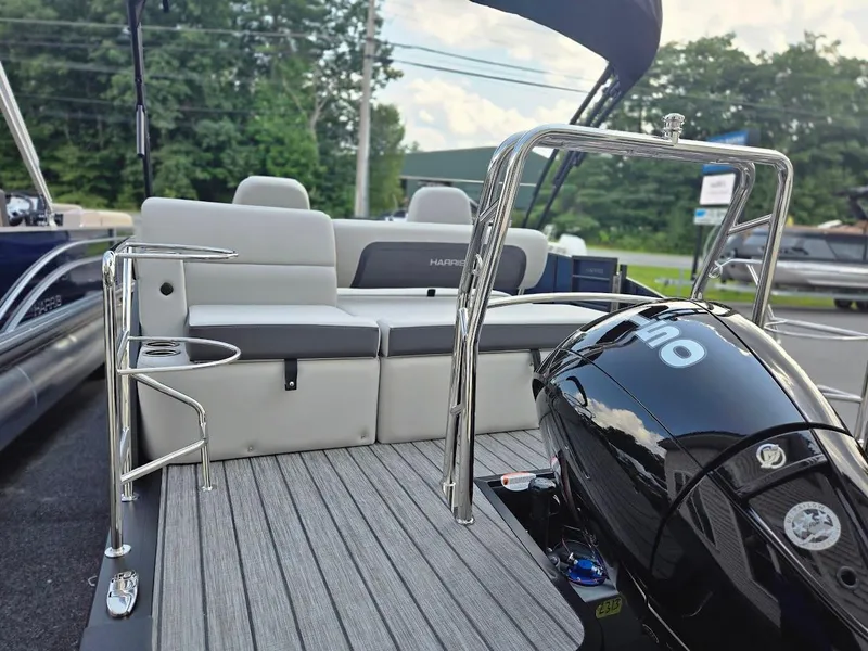 Slide: The Image of 2025 Harris Cruiser 230 pontoon boat with sleek seating and powerful engine. - 6