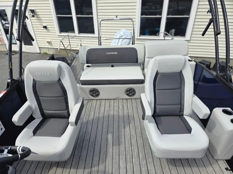Slide: The Image of 2025 Harris Cruiser 230 boat interior with gray seating and modern design. - 8