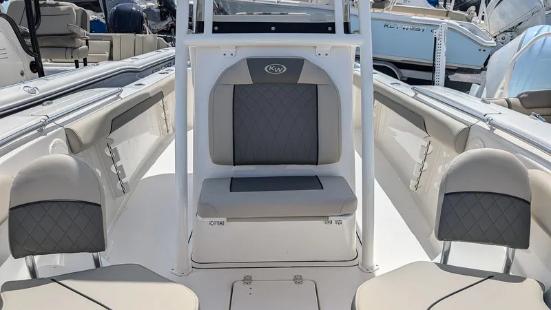 Slide: The Image of 2025 Key West 244 Center Console boat interior with gray seating and modern design. - 16