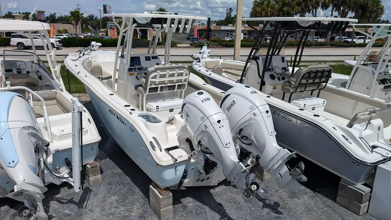 Slide: The Image of 2025 Key West 244 Center Console boats with dual engines on display. - 2