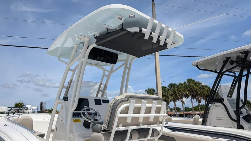 Slide: The Image of 2025 Key West 244 Center Console boat with T-top and helm station. - 21