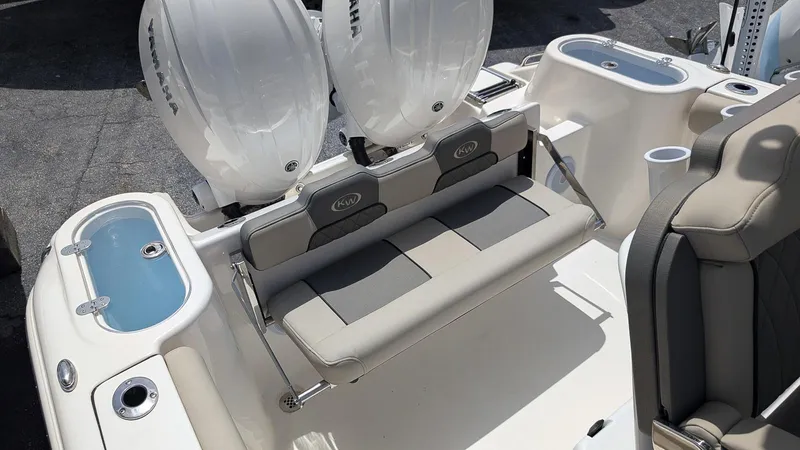 Slide: The Image of 2025 Key West 244 Center Console boat with dual engines and seating area. - 8