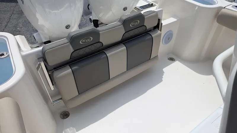 Slide: The Image of 2025 Key West 244 Center Console boat seating area with dual engines. - 9