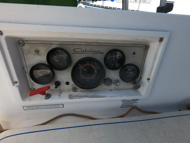 Slide: The Image of Control panel of a 1985 Catalina 30 sailboat with gauges and switches. - 9