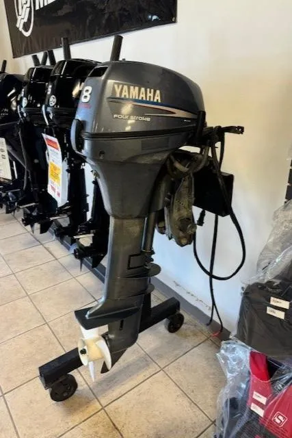 Slide: The Image of 2010 Yamaha Outboards T8 motor displayed in showroom. - 3