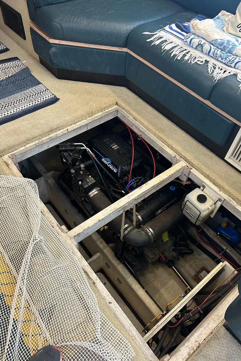 Slide: The Image of Engine compartment of a 1997 Bayliner 3788 Command Bridge Motoryacht, showcasing mechanical components. - 10