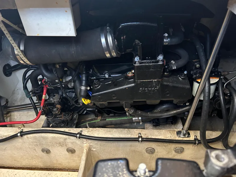 Slide: The Image of Engine compartment of a 1997 Bayliner 3788 Command Bridge Motoryacht, showcasing mechanical components. - 11