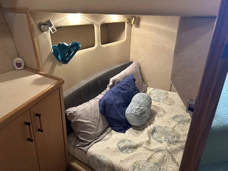 Slide: The Image of Cozy cabin interior of 1997 Bayliner 3788 Command Bridge Motoryacht with bed and lighting. - 12