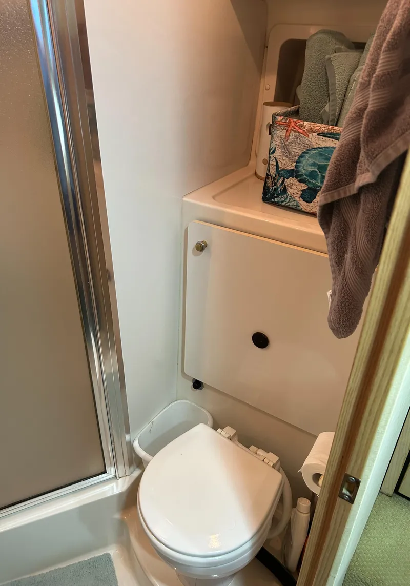 Slide: The Image of Bathroom in 1997 Bayliner 3788 Command Bridge Motoryacht with shower and storage. - 15