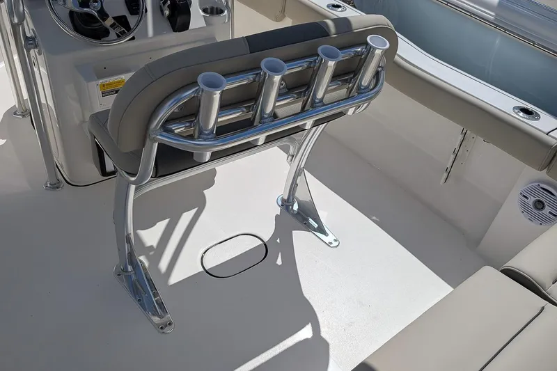 Slide: The Image of 2026 Key West 203 FS boat interior with rod holders and seating. - 12