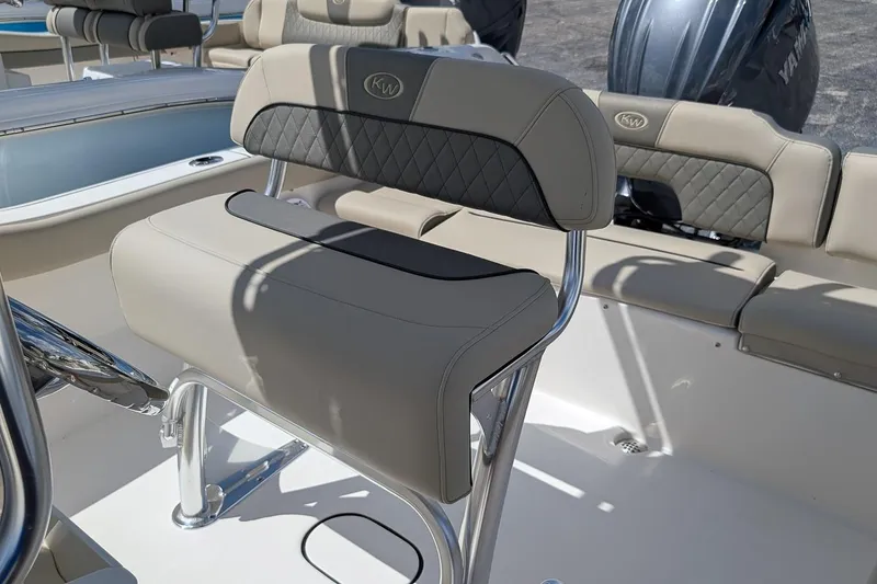 Slide: The Image of 2026 Key West 203 FS boat interior with cushioned seating and stainless steel details. - 13