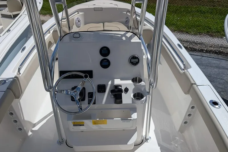 Slide: The Image of 2026 Key West 203 FS boat console with steering wheel and controls. - 14
