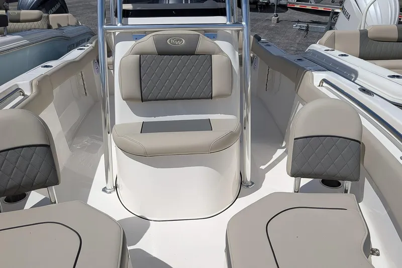 Slide: The Image of 2026 Key West 203 FS boat interior with cushioned seating and sleek design. - 17