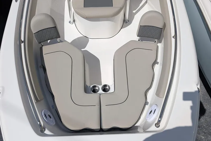 Slide: The Image of 2026 Key West 203 FS boat interior with cushioned seating and cup holders. - 18