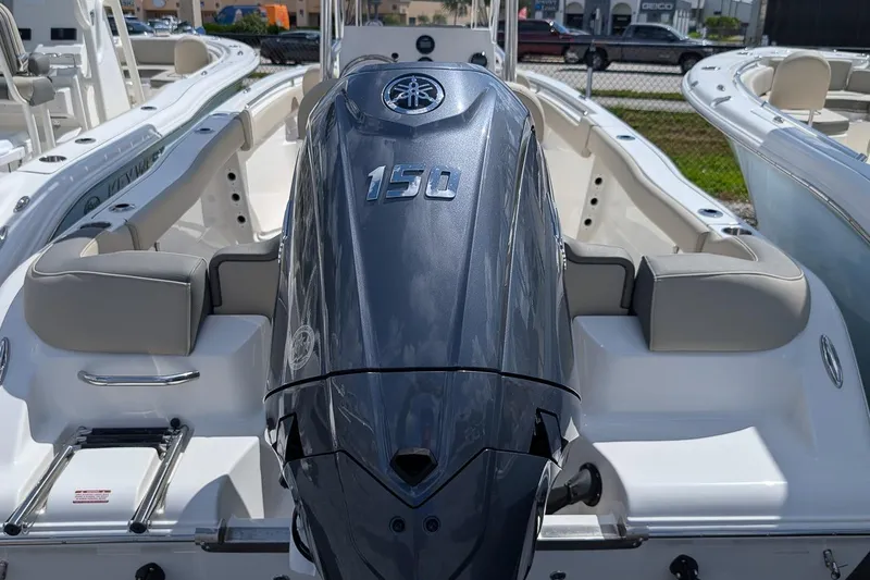 Slide: The Image of 2026 Key West 203 FS boat with Yamaha 150 engine, docked in a marina. - 4
