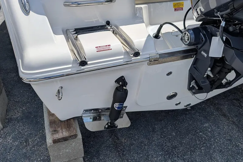 Slide: The Image of 2026 Key West 203 FS boat stern with motor and ladder on display. - 5