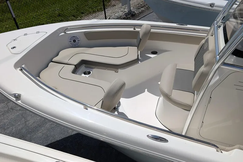 Slide: The Image of 2026 Key West 203 FS boat interior with beige seating and modern design. - 7