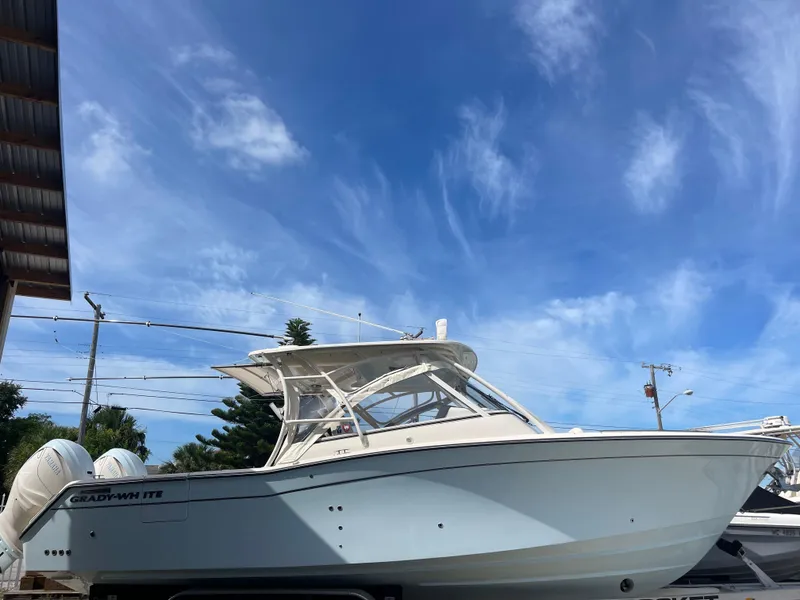 The Image of 2023 Grady-White Freedom 335 boat under a clear blue sky. - 0