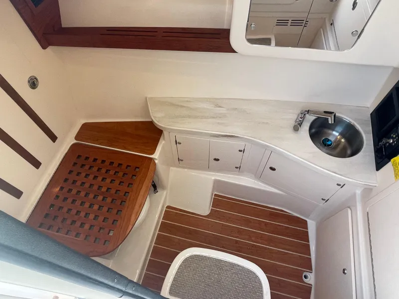 Slide: The Image of 2023 Grady-White Freedom 335 boat interior with seating and helm station. - 10