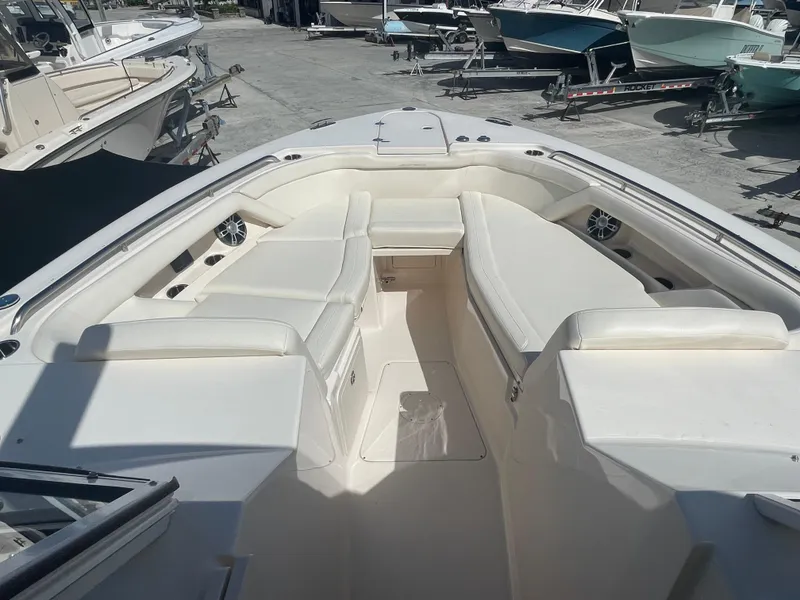 Slide: The Image of Display screen of 2023 Grady-White Freedom 335 showing trip and total hours data. - 11