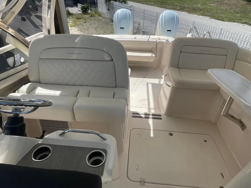 Slide: The Image of Dashboard of 2023 Grady-White Freedom 335 with Garmin navigation displays and Yamaha controls. - 13