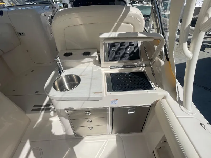 Slide: The Image of 2023 Grady-White Freedom 335 boat radar against clear blue sky. - 16