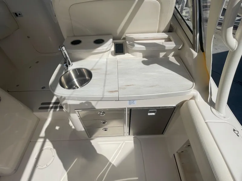 Slide: The Image of Garmin radar on 2023 Grady-White Freedom 335 boat under clear blue sky. - 17