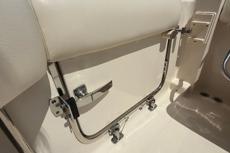 Slide: The Image of 2023 Grady-White Freedom 335 boat interior detail, featuring seat and stainless steel hardware. - 25