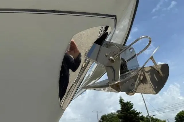 Slide: The Image of 2023 Grady-White Freedom 335 boat anchor detail against blue sky. - 37