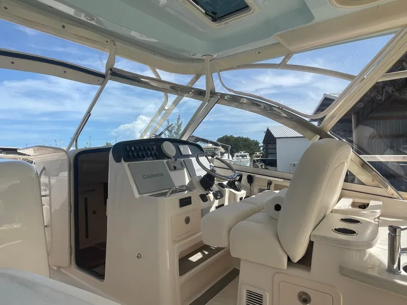 Slide: The Image of 2023 Grady-White Freedom 335 boat with triple 300 V6 outboard engines. - 9