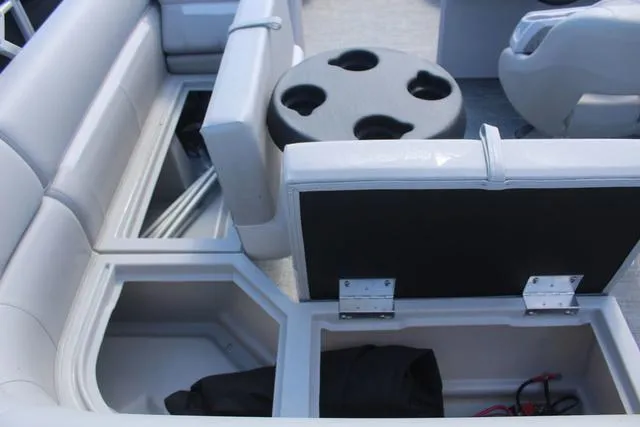 Slide: The Image of 2025 Godfrey Pontoons Xperience 1680 CX interior storage compartments and seating area. - 10