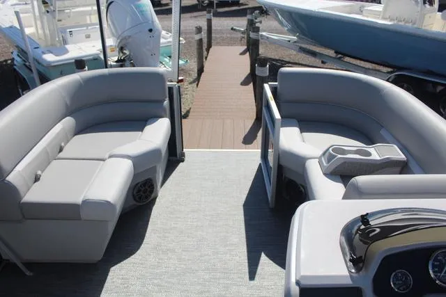 Slide: The Image of 2025 Godfrey Pontoons Xperience 1680 CX interior with gray seating and cup holders. - 5
